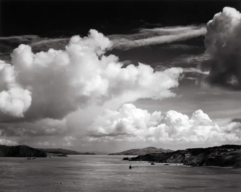 Ansel Adams Art Photography poster featuring a dramatic black and white landscape view of a bay or coastline with towering cumulus clouds.