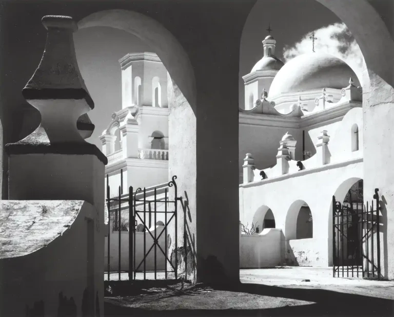 Ansel Adams Art Photography poster featuring the Mission San Xavier del Bac church arches and dome in dramatic high contrast black and white.