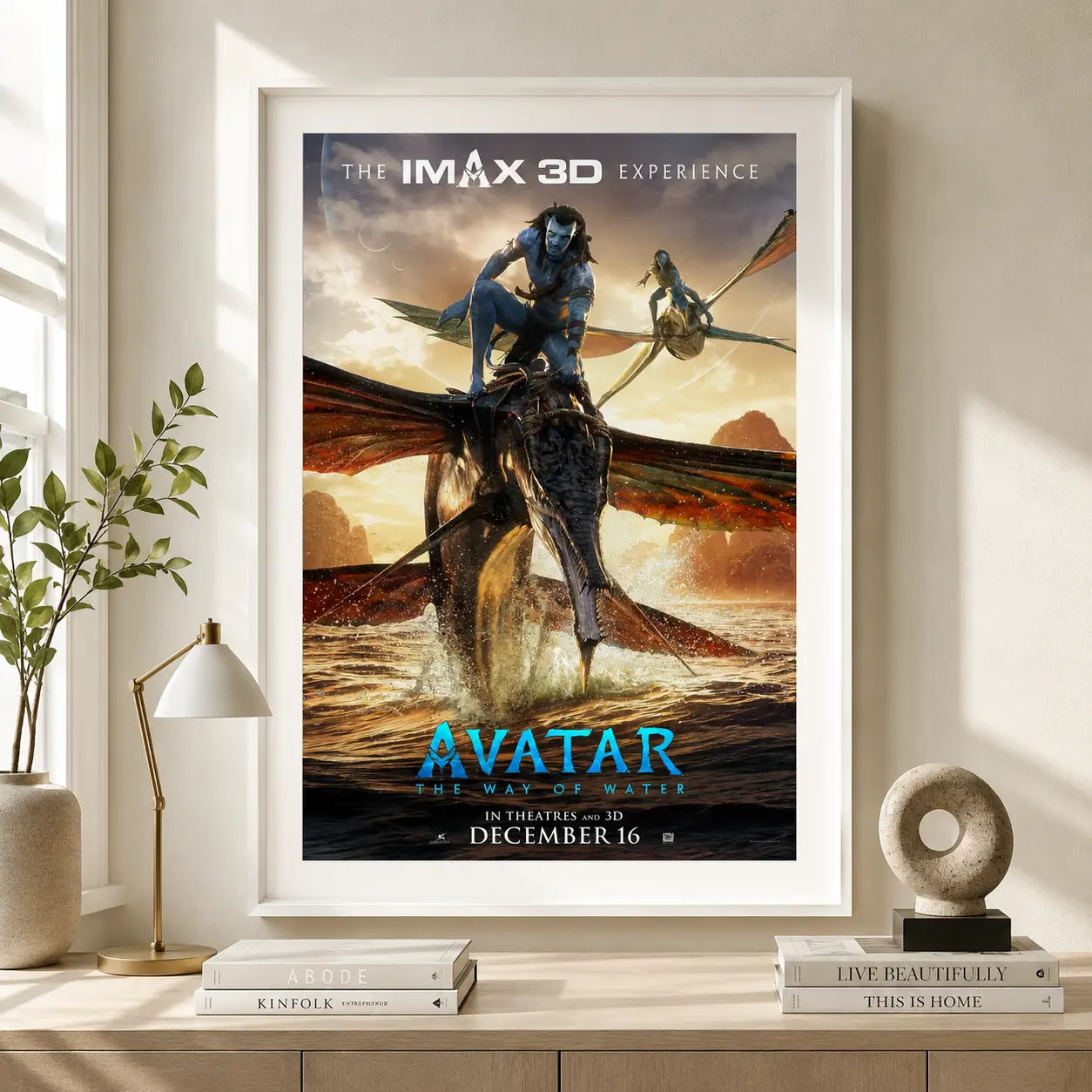 Room mockup of Avatar The Way of Water 2022 IMAX Movie Poster, displayed as framed wall art in a home theater setting as a portrait print with gold and orange tones.
