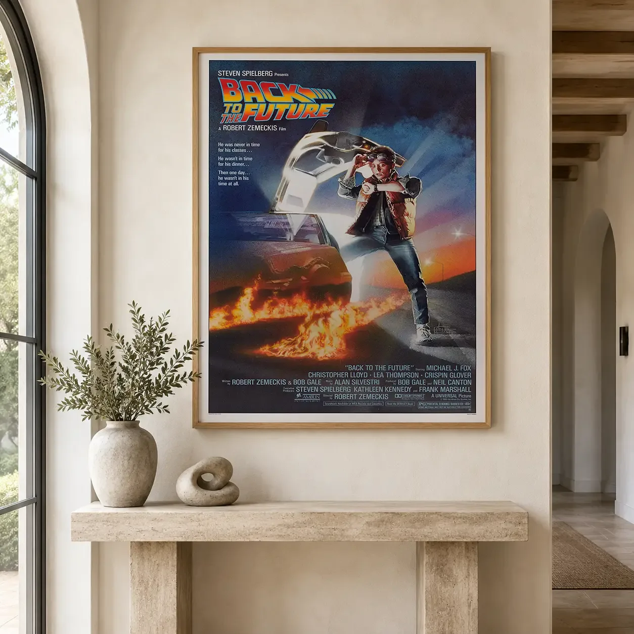 Room mockup of Back to the Future 1985 Marty McFly DeLorean Movie Poster, displayed as framed wall art in a home theater setting as a portrait print with orange tones.