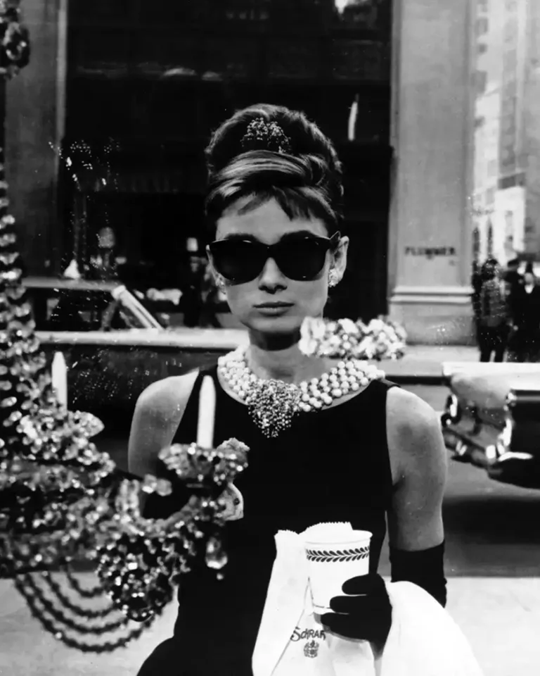 Breakfast at Tiffany's Movie poster featuring Audrey Hepburn as Holly Golightly in iconic black dress, pearls, and sunglasses.