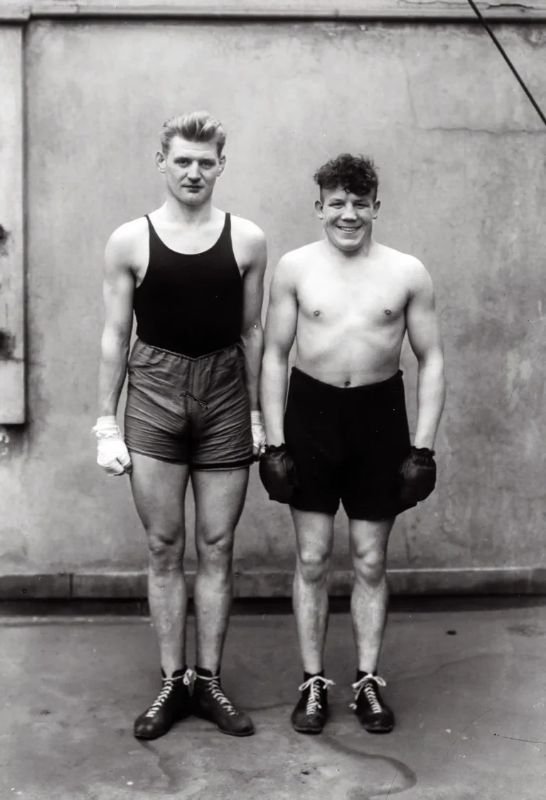 August Sander 'Boxers' fine art photography poster featuring two vintage German boxers in athletic attire, captured in high-contrast black and white.