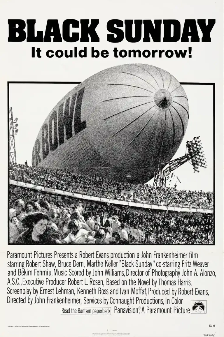 Black Sunday Movie poster featuring a highly dramatic black and white image of the Super Bowl blimp descending into a panicked stadium crowd.