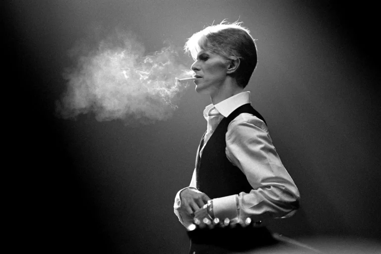 David Bowie Music poster featuring the legendary artist in a black and white smoking portrait.