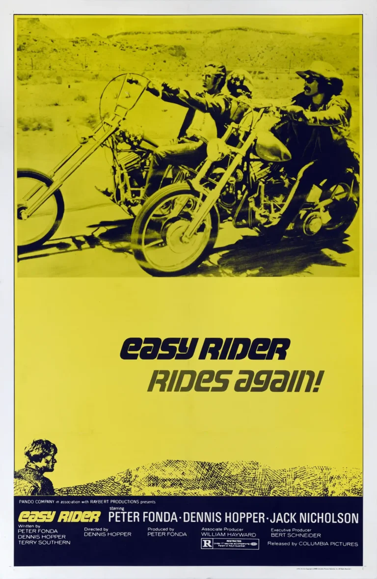Easy Rider Movie poster featuring Peter Fonda and Dennis Hopper riding their iconic Captain America and Billy choppers against a high-contrast yellow desert background.