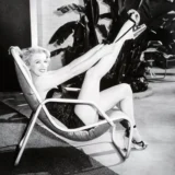 Marilyn Monroe Lounging in Patio Chair Black and White Photography Print