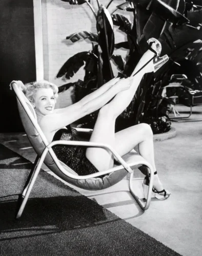 Marilyn Monroe Lounging in Patio Chair Black and White Photography Print