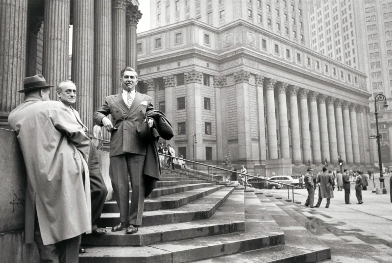 Henri Cartier-Bresson Wall Street 1947 photography poster featuring men in suits standing on the steps of a massive columned financial building in New York City.
