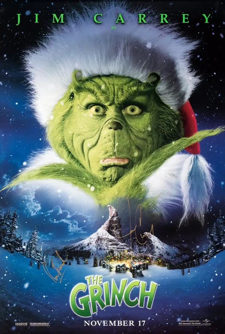 The Grinch (2000 film) Movie poster featuring a large close-up of Jim Carrey as the Grinch looking down menacingly over snowy Whoville.