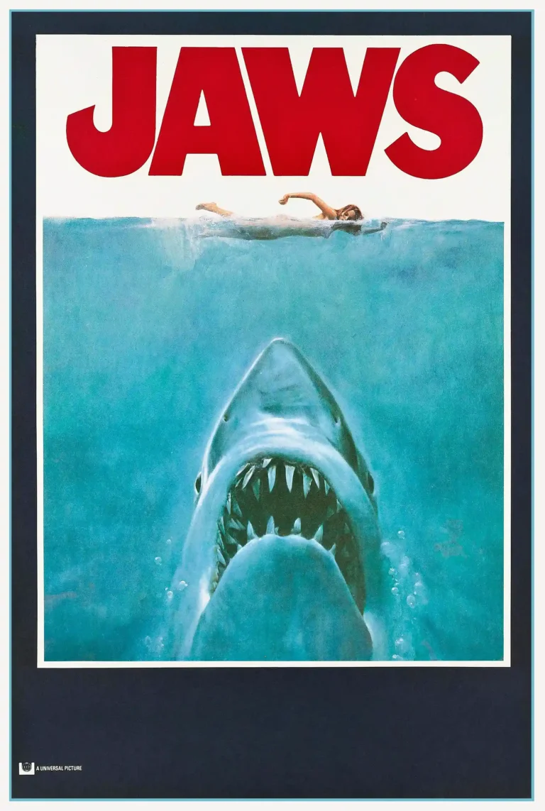Jaws (1975) Movie poster featuring the iconic image of a giant great white shark rising toward an unaware female swimmer swimming on the surface.