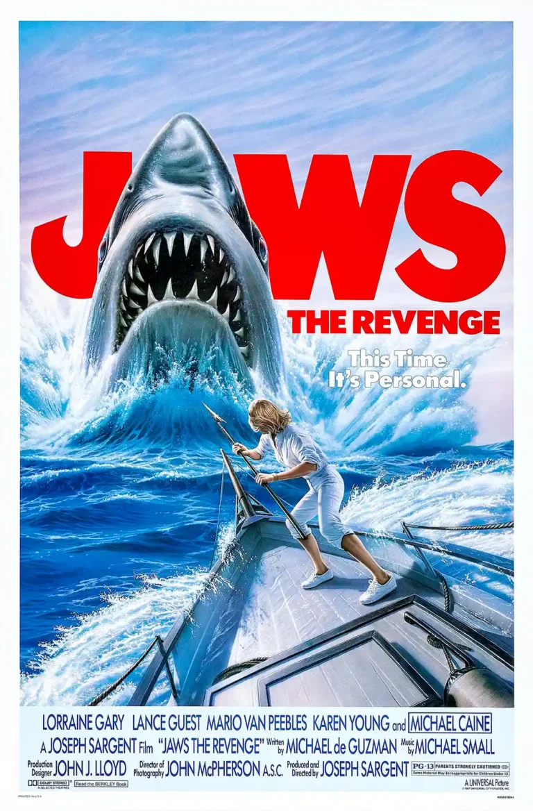 Jaws The Revenge (1987) horror film poster featuring a massive great white shark attacking Ellen Brody on a boat, set against the iconic red title logo.