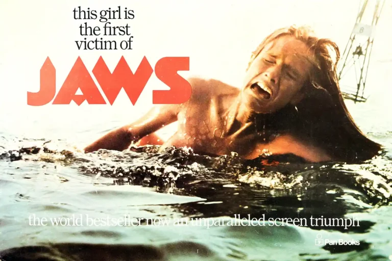 Jaws Movie poster featuring Chrissie Watkins screaming in the water beneath the iconic large red JAWS title font, replicating the vintage 1975 paperback ad.