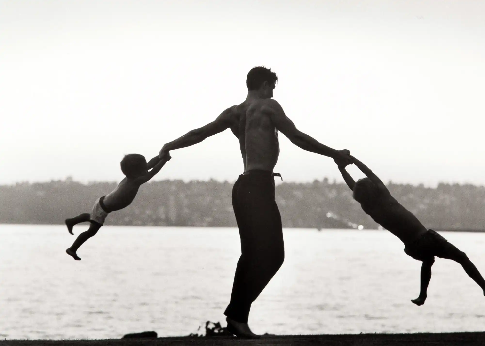 John Dominis | Fine Art Print Poster | Father Swinging Kids Silhouette