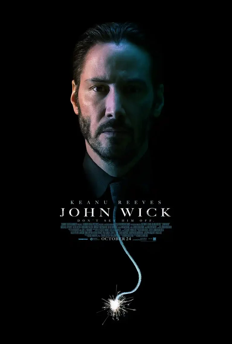 John Wick movie poster featuring a close-up, intense, minimalist portrait of Keanu Reeves under dramatic blue lighting on a black background.