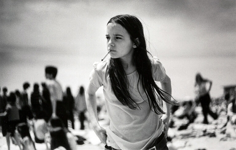 Joseph Szabo fine art poster of 'Priscilla' at Jones Beach, 1969, featuring a young girl holding a cigarette in high-contrast black and white.