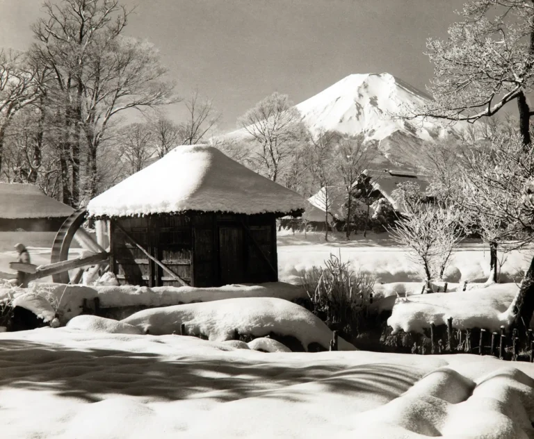 Koyo Okada fine art photography poster featuring a high-contrast black and white image of Mount Fuji towering over a snow-covered watermill.