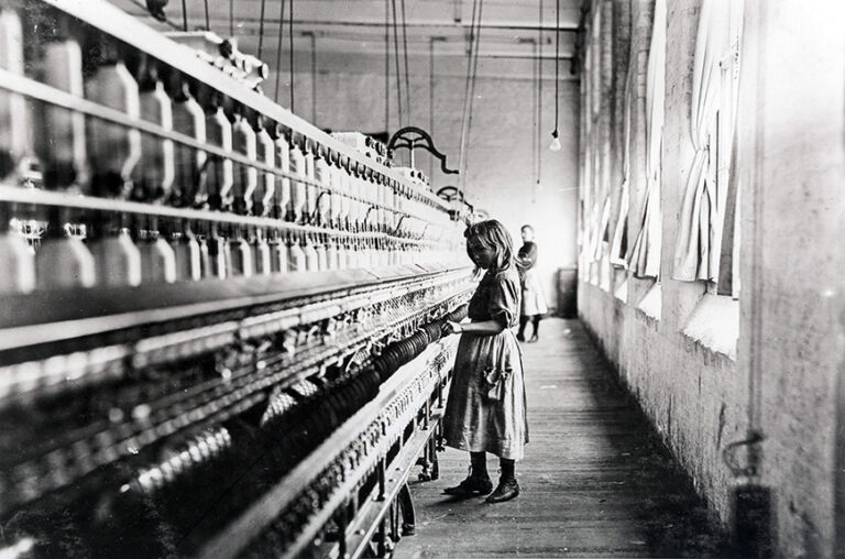Lewis Hine Child Labor Art poster featuring a young girl working at large spinning machinery in a black and white cotton mill photograph.