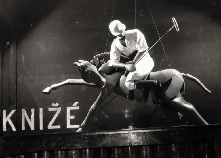 Man Ray vintage Art Deco poster featuring a mannequin polo player riding a stylized wooden horse in a Knižé window display advertisement.