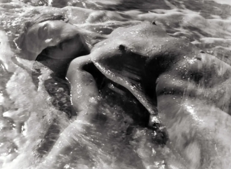 Ruth Bernhard abstract fine art photography poster featuring a black and white image of a human figure submerged in textured, rushing water.