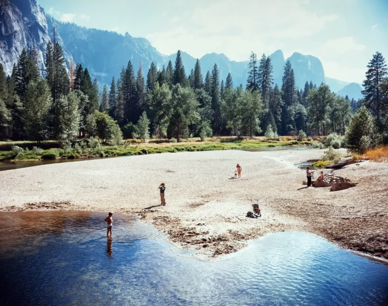 Stephen Shore Fine Art photography poster featuring a sunny riverbank, pine forest, and misty blue mountains in Yosemite National Park, California.