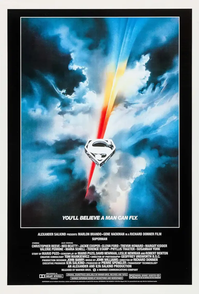 Superman 1978 theatrical movie poster featuring the metallic 'S' shield logo floating against a dramatic, colorful sky with red and yellow light streaks.