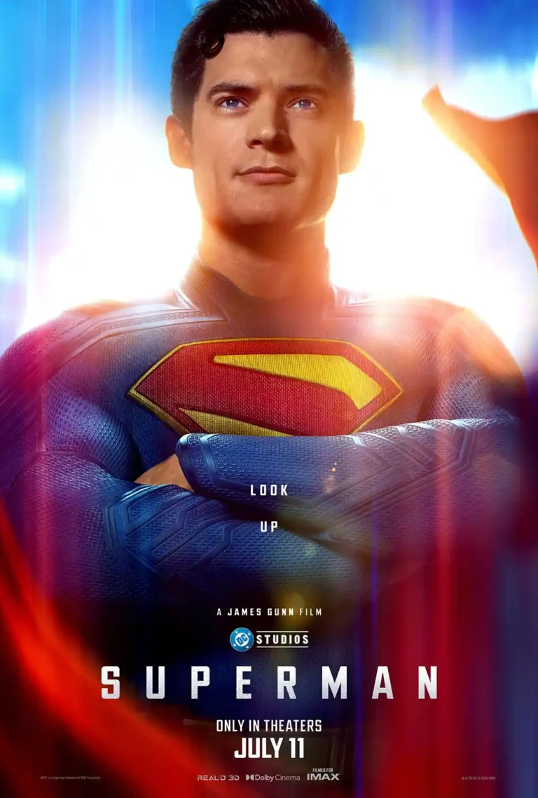 Superman (2025) Movie poster featuring David Corenswet in the new DCU suit, arms crossed, against a powerful glowing light backdrop.