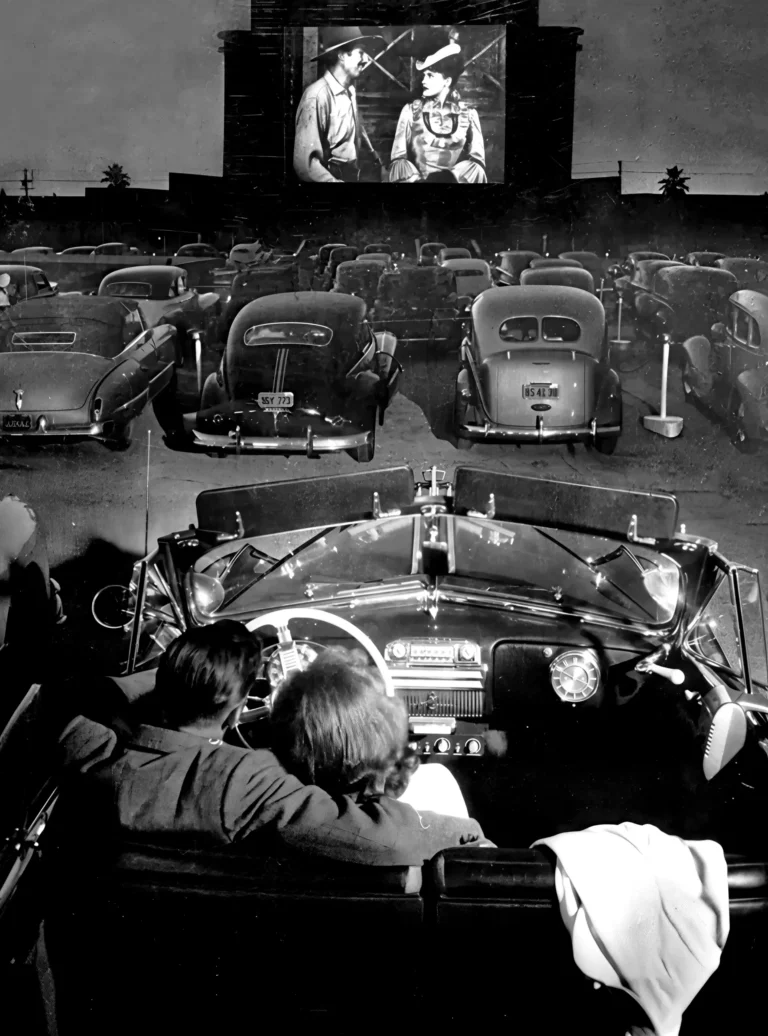 Vintage Drive-In Cinema Art poster featuring a black and white scene of a couple watching a movie in a classic car.