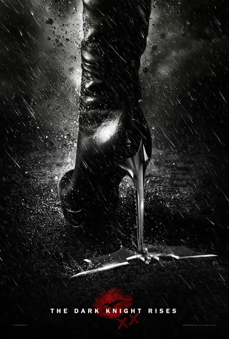 The Dark Knight Rises (2012) movie poster featuring Catwoman's black high heel boot crushing a broken Batarang in the dark rain.