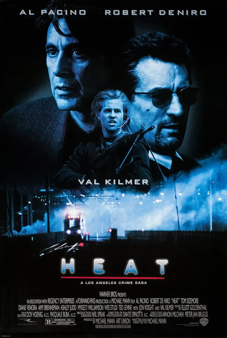 Heat movie poster featuring dramatic, blue-toned portraits of lead actors Al Pacino, Robert De Niro, and Val Kilmer over a nighttime cityscape.