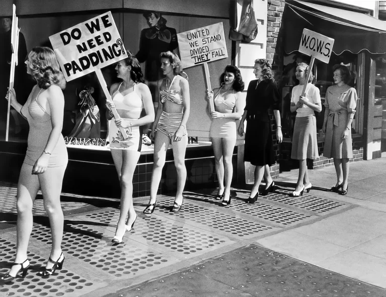 Berkeley 1947 poster featuring women in 1940s swimwear holding protest signs on a city sidewalk in black and white.