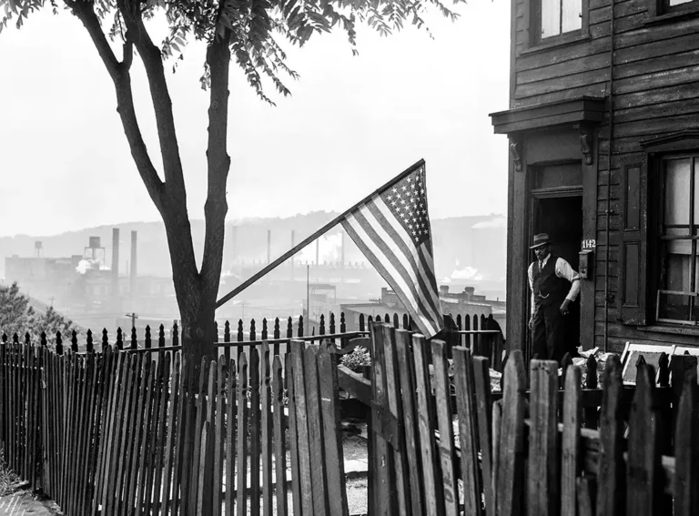 Pittsburgh 1941 flag print showing an African American man by a flag with steel mills in the background.