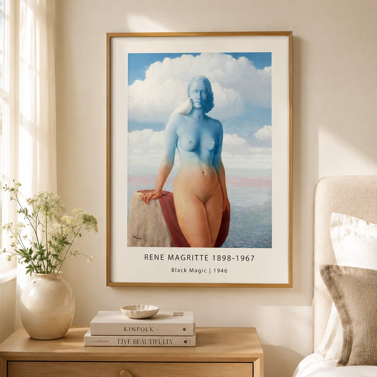 Room mockup of Black Magic Poster, Magritte Sky Figure Surrealist Art, displayed as framed wall art in a living room setting as a portrait print with blue, black, and white tones.