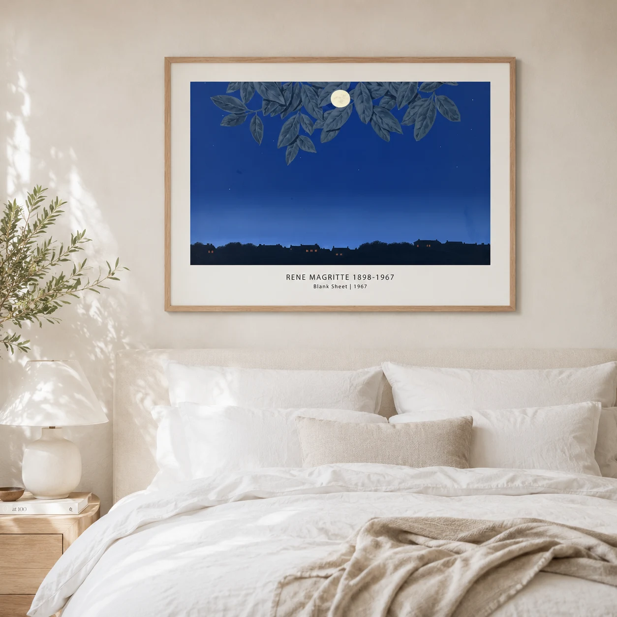 Room mockup of Blank Page Print, Magritte Moonlit Leaf Surrealist Art, displayed as framed wall art in a bedroom setting as a landscape print with blue and green tones.