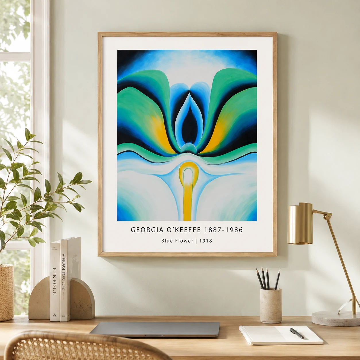 Room mockup of Blue Flower Print, Georgia O'Keeffe Pastel Floral Wall Art Print, displayed as framed wall art in a bedroom setting as a portrait print with blue and red tones.