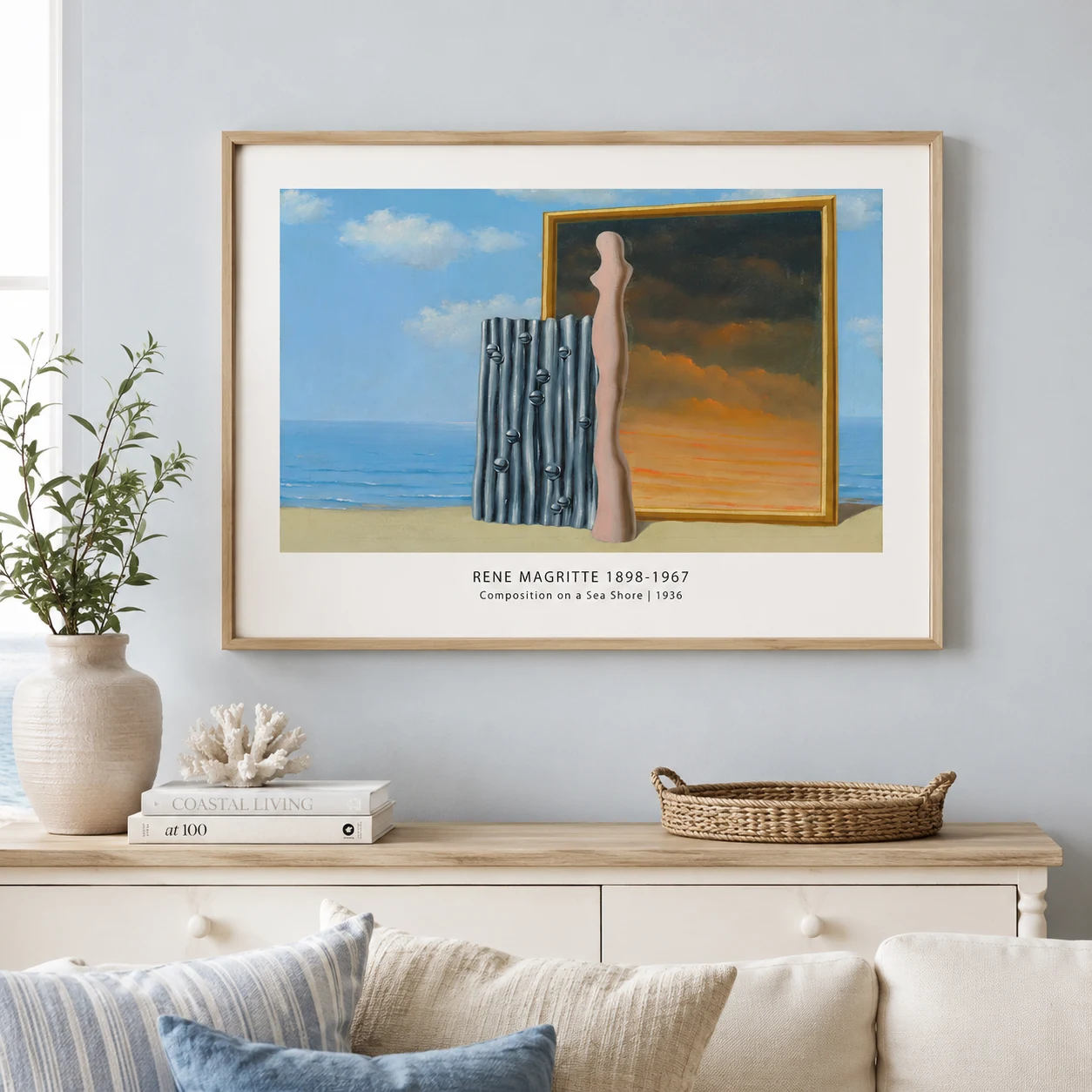 Room mockup of Composition on a Sea Shore Print, Magritte Coastal Wall Art Print, displayed as framed wall art in a bedroom setting as a landscape print with blue and pink tones.