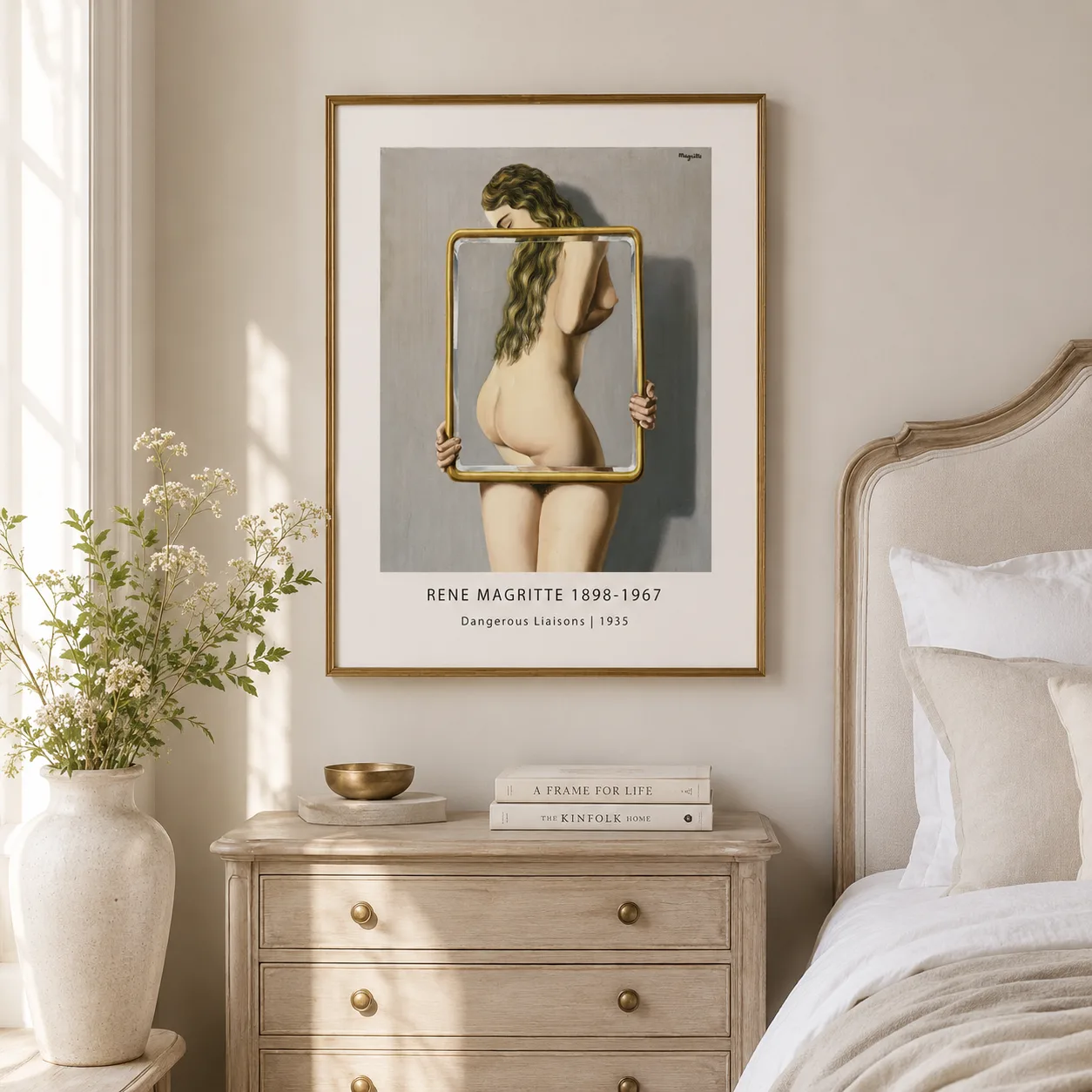 Room mockup of Dangerous Liaisons Print, Magritte Mirror Figure Wall Art Print, displayed as framed wall art in a living room setting as a portrait print with black and white and gold tones.