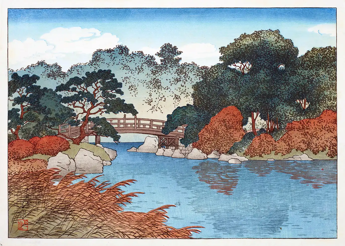 Japanese garden print showing a 1920 woodblock scene with a bridge over a pond and red autumn trees.