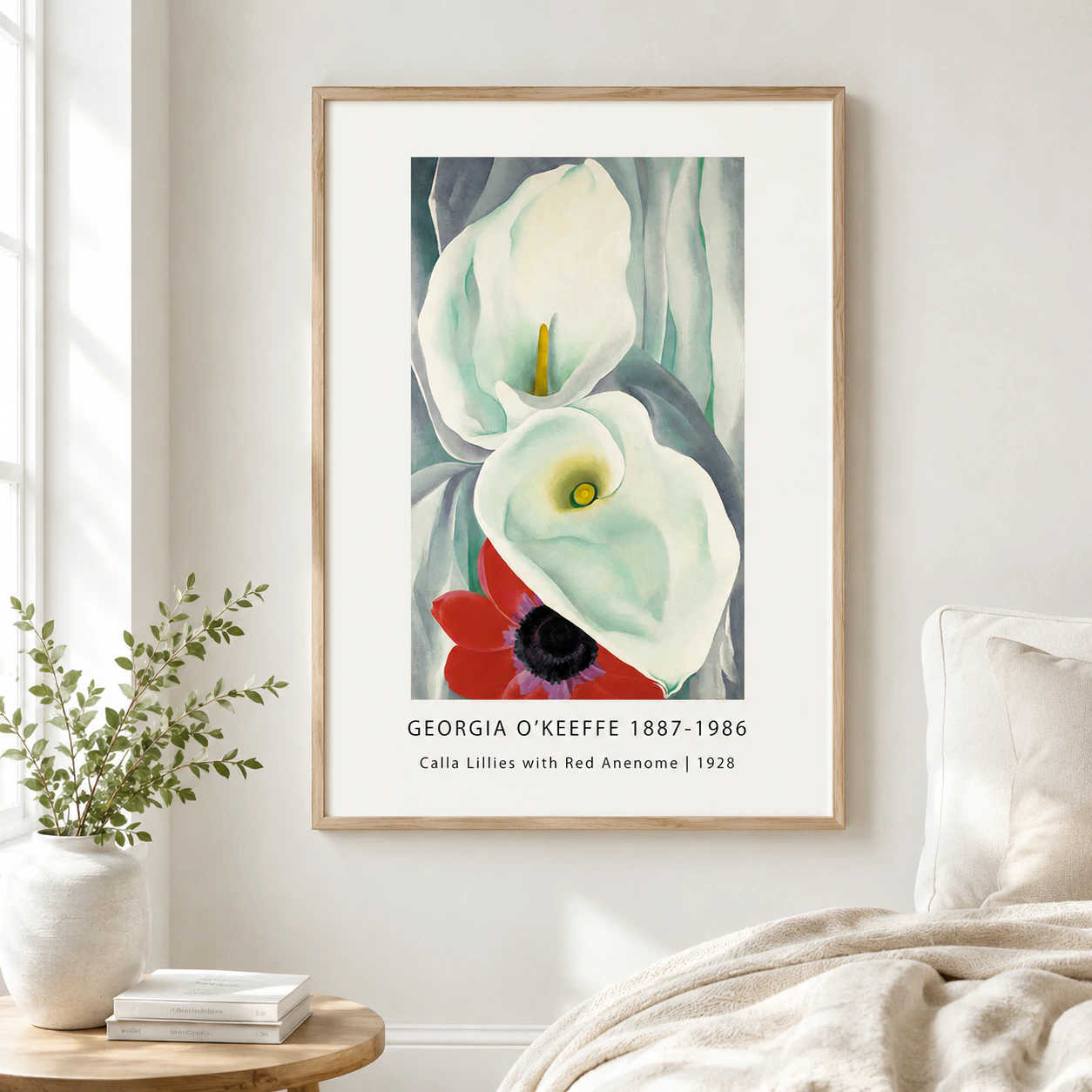 Room mockup of Calla Lilies Print, White Flowers With Red Anemone Art, displayed as framed wall art in a bedroom setting as a portrait print with yellow, red, and white tones.