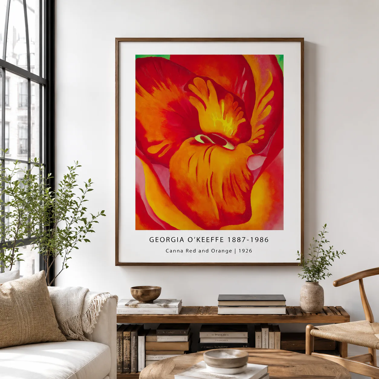 Room mockup of Red Canna Print, Georgia O'Keeffe Orange Floral Wall Art Print, displayed as framed wall art in a bedroom setting as a portrait print with blue, green, and yellow tones.