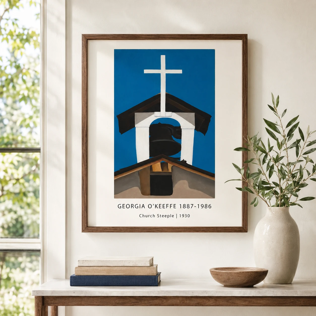Room mockup of Church Steeple Print, O'Keeffe Adobe Architecture Wall Art Print, displayed as framed wall art in a living room setting as a portrait print with black and white tones.