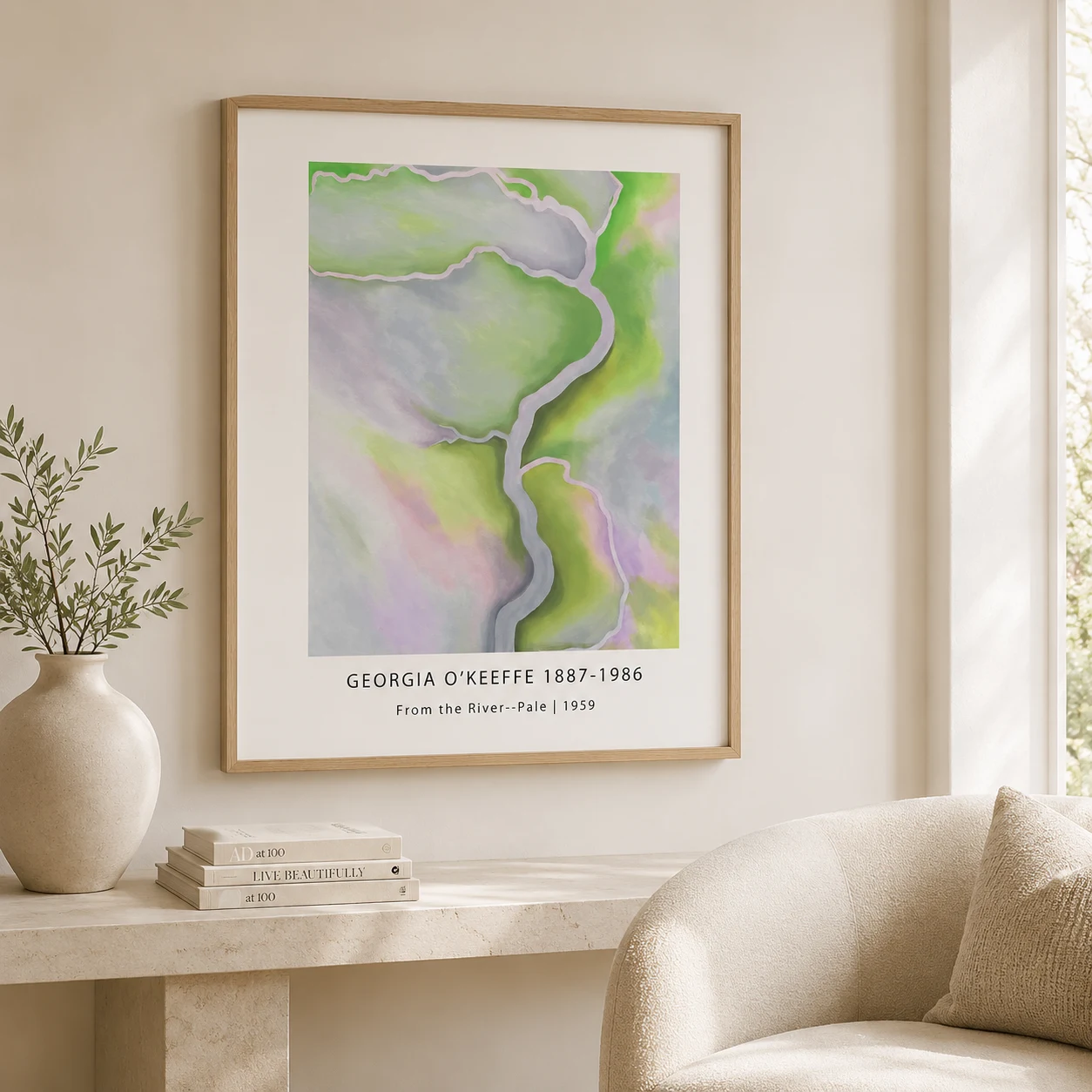 Room mockup of From the River Print, Georgia O'Keeffe Pale Abstract Art, displayed as framed wall art in a living room setting as a portrait print with green and pink tones.