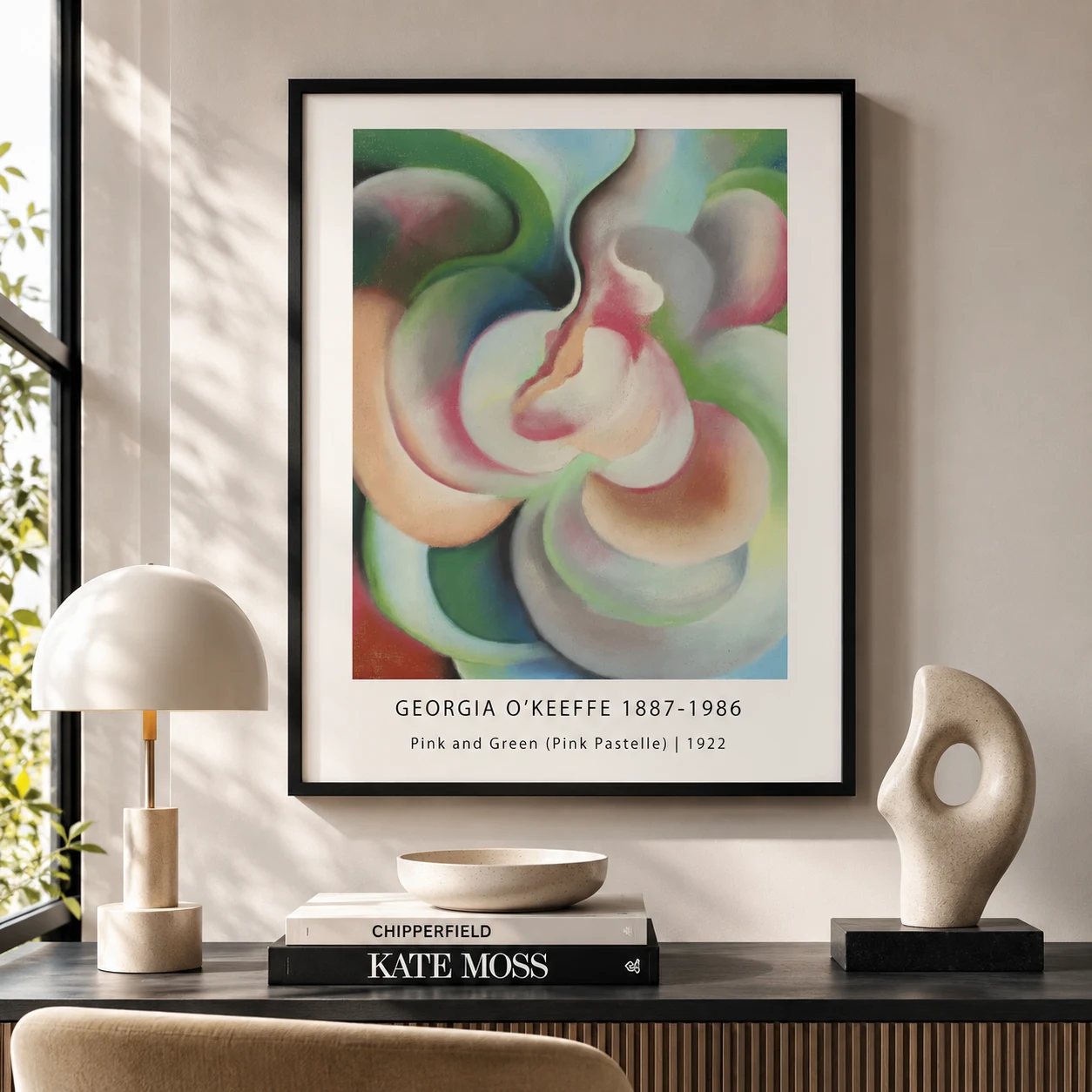 Room mockup of Pink and Green Print, Georgia O'Keeffe Pastel Abstract Art, displayed as framed wall art in a living room setting as a portrait print with blue, green, and red tones.