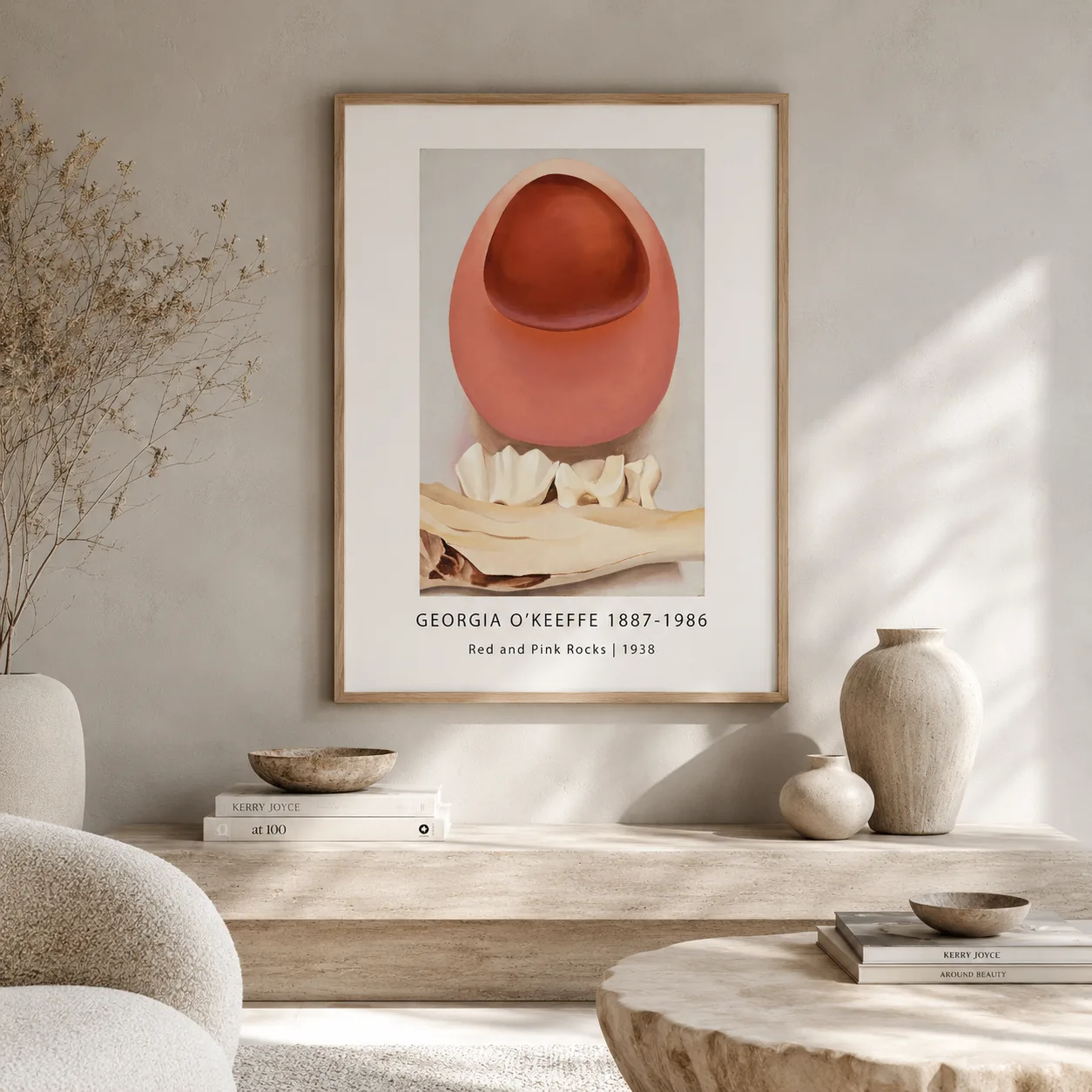 Room mockup of Red and Pink Rocks Print, Georgia O'Keeffe Abstract Art, displayed as framed wall art in a living room setting as a portrait print with red, pink, and brown tones.