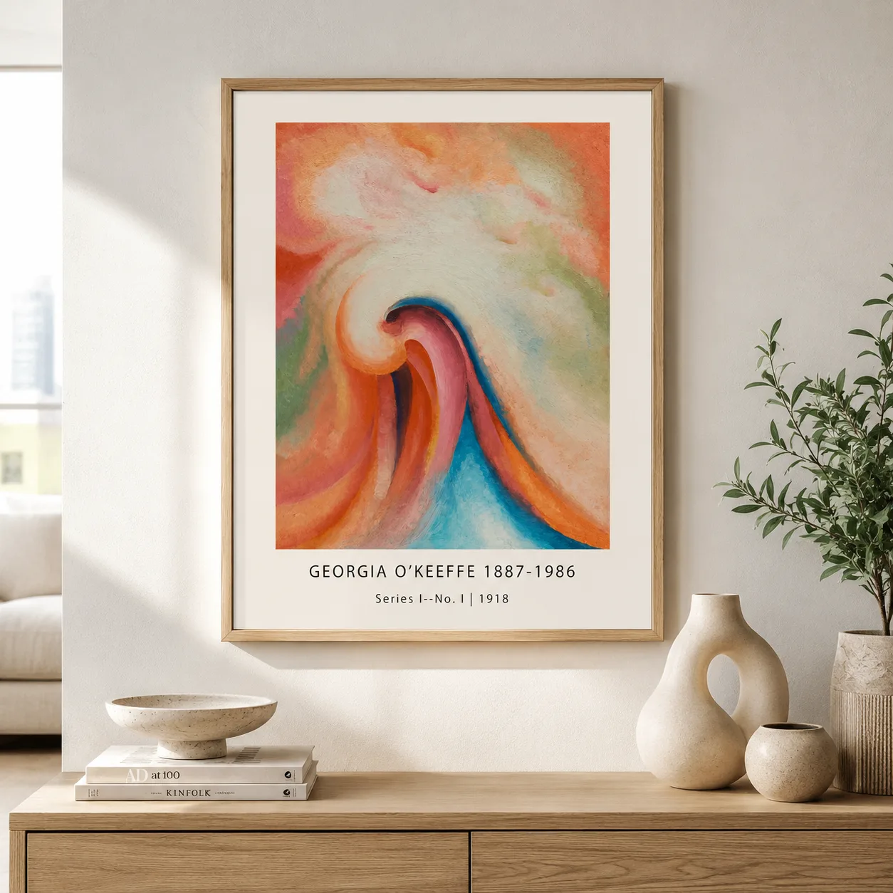 Room mockup of Series I No. I Print, Georgia O'Keeffe 1918 Abstract, displayed as framed wall art in a living room setting as a portrait print with blue, orange, and pink tones.