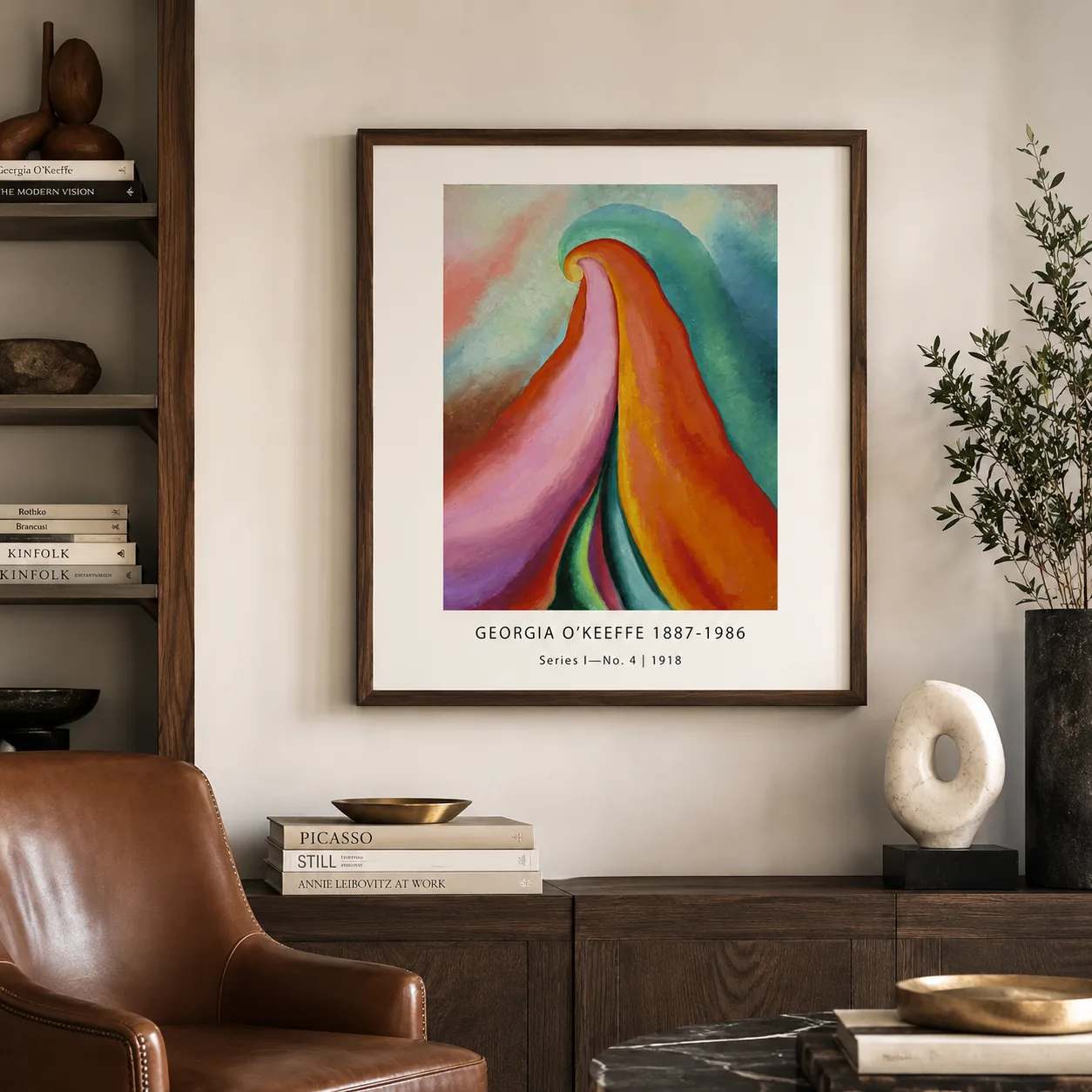 Room mockup of Series I No. 4 Print, Georgia O'Keeffe warm Abstract, displayed as framed wall art in a living room setting as a portrait print with blue, teal, and green tones.