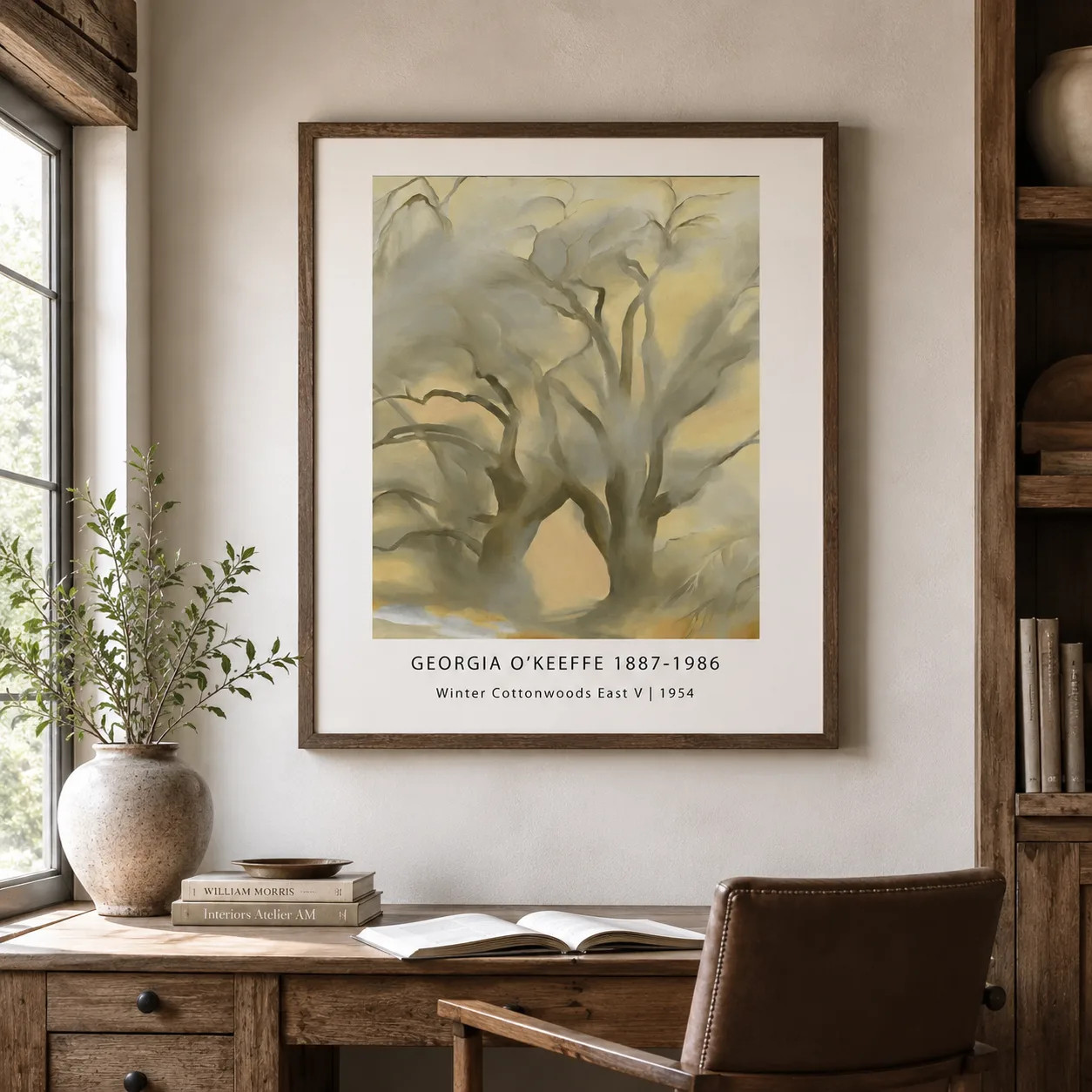 Room mockup of Winter Cottonwoods Print, Georgia O'Keeffe Tree Wall Art Print, displayed as framed wall art in a bedroom setting as a portrait print with blue and grey tones.