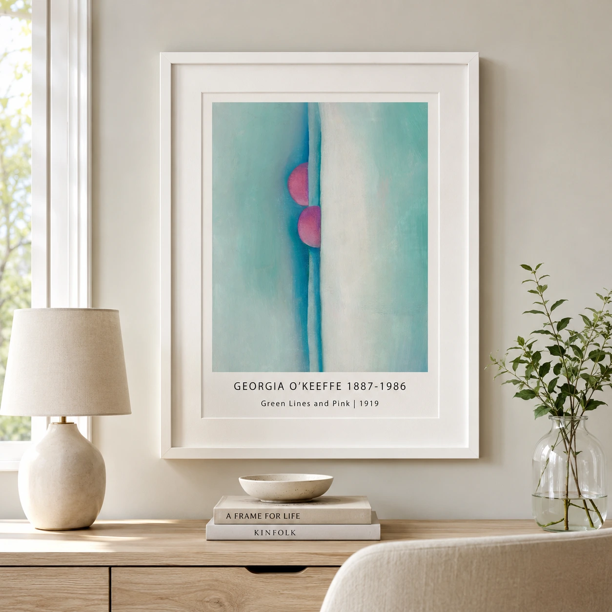 Room mockup of Green Lines and Pink Print, O'Keeffe Abstract Art, displayed as framed wall art in a living room setting as a portrait print with teal, green, and pink tones.