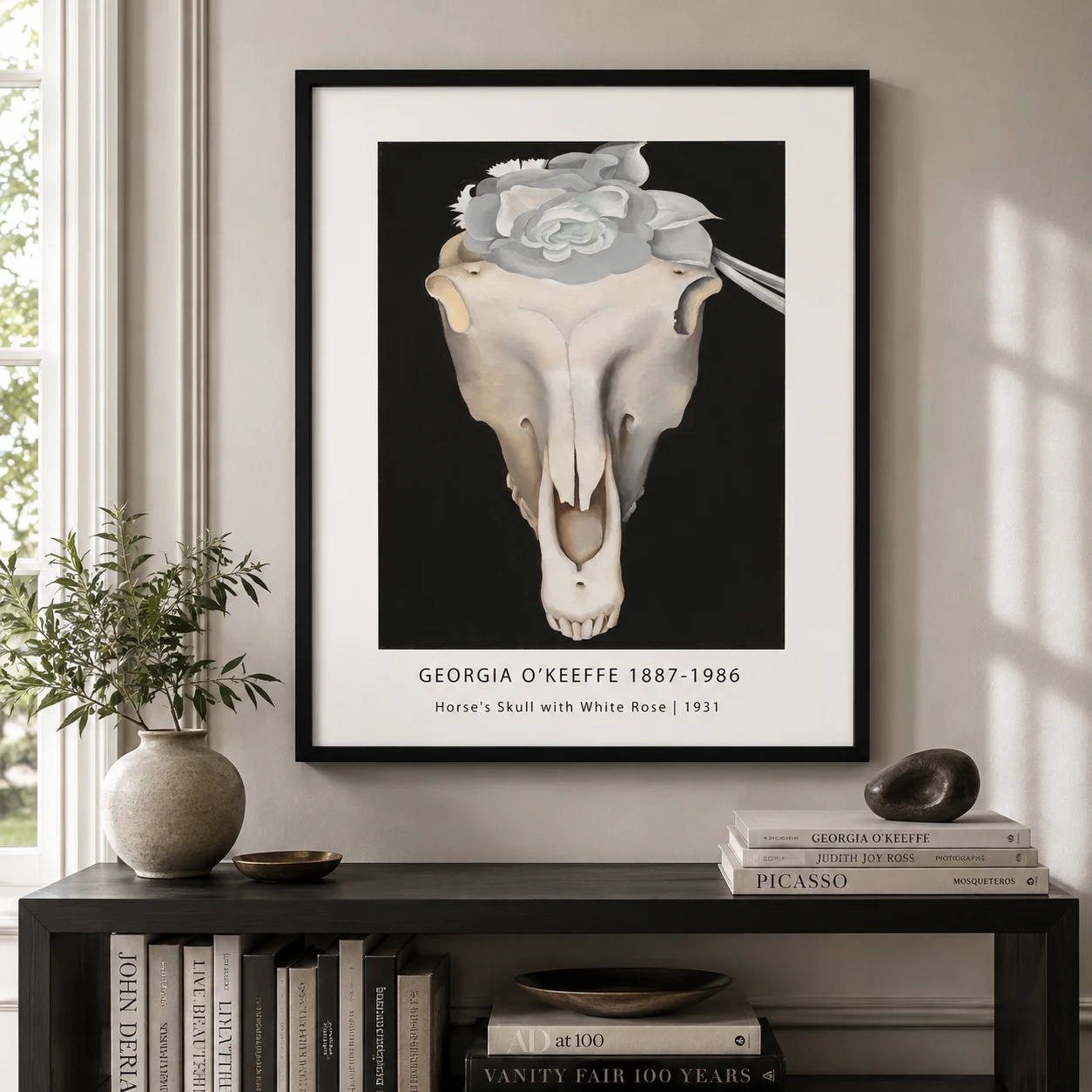 Room mockup of Horse Skull Print, Georgia O'Keeffe White Rose Wall Art Print, displayed as framed wall art in a bedroom setting as a portrait print with pink, black, and white tones.