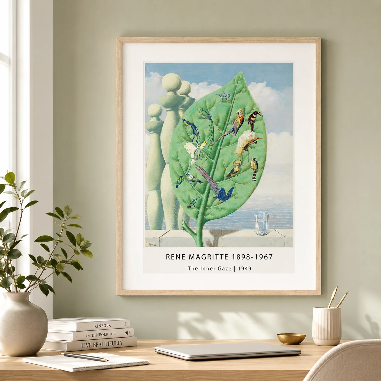 Room mockup of Inner Gaze Print, Magritte Leaf and Tropical Birds Wall Art Print, displayed as framed wall art in a bedroom setting as a portrait print with green tones.