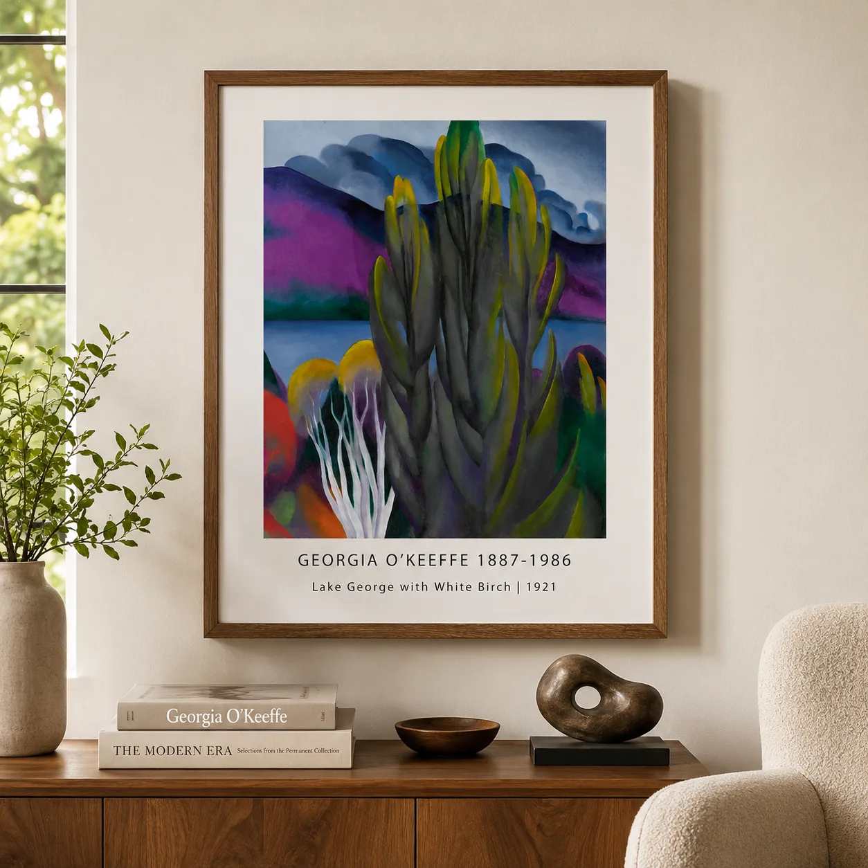 Room mockup of White Birch Print, Georgia O'Keeffe Lake George Wall Art Print, displayed as framed wall art in a living room setting as a portrait print with blue, purple, and white tones.